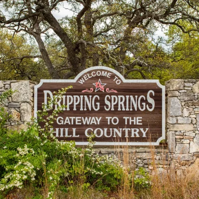 DrippingSpringsSign_AdobeStock Dripping Springs, TX